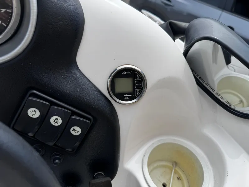 Slide: The Image of Dashboard of 2003 Yamaha Boats 210LX with controls and digital display. - 7