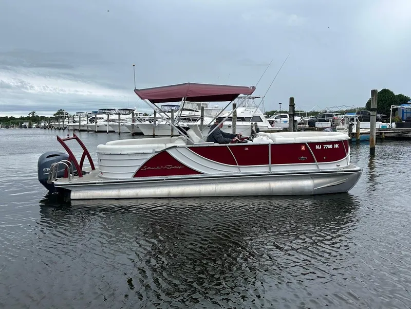 Slide: The Image of 2017 South Bay 500RS pontoon boat with red canopy on a calm marina. - 3