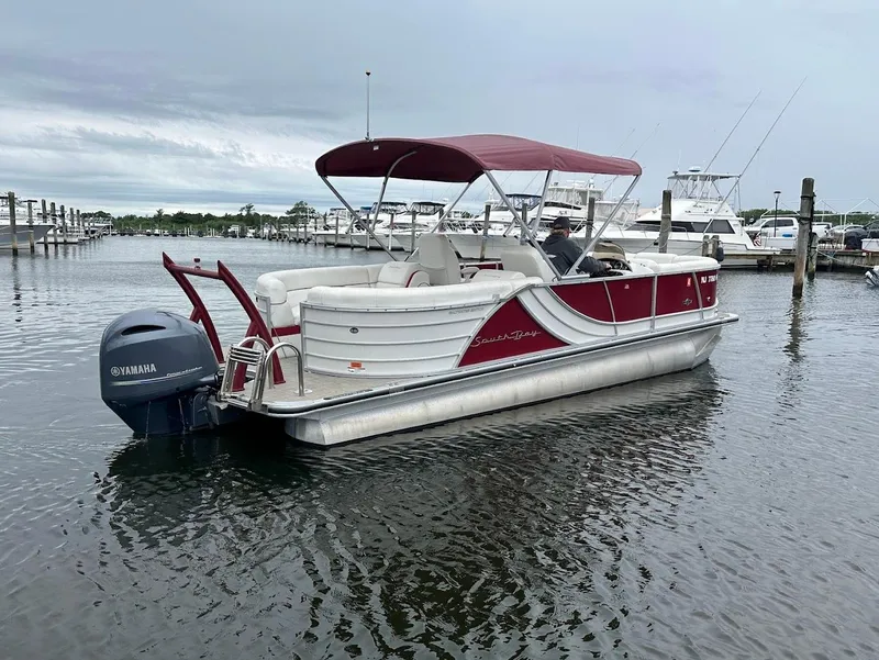 Slide: The Image of 2017 South Bay 500RS pontoon boat with Yamaha motor docked in marina. - 4