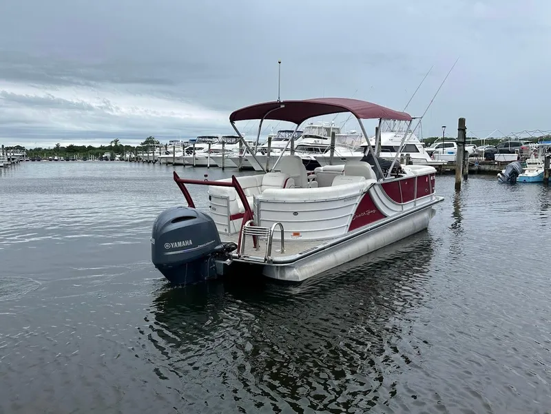 Slide: The Image of 2017 South Bay 500RS pontoon boat docked with Yamaha outboard motor. - 5