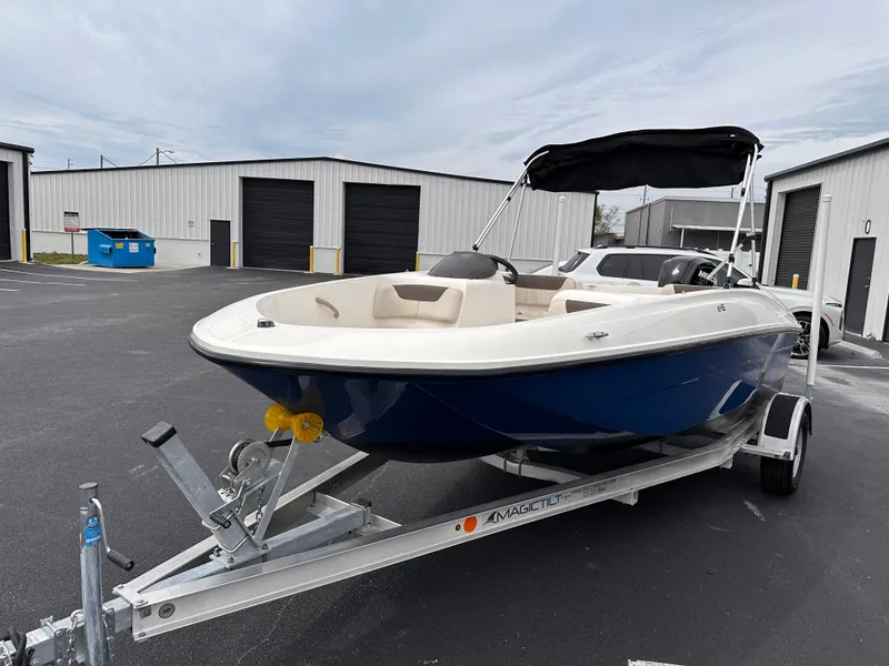 Slide: The Image of 2020 Bayliner Element boat on trailer in storage facility. - 2