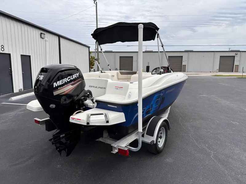 Slide: The Image of 2020 Bayliner Element boat with Mercury outboard motor on trailer. - 3