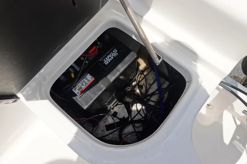 Slide: The Image of Battery compartment of 2022 Key Largo 1800 Center Console boat, showing wiring and connections. - 11