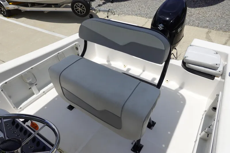 Slide: The Image of 2022 Key Largo 1800 Center Console boat interior with seating and steering wheel. - 13