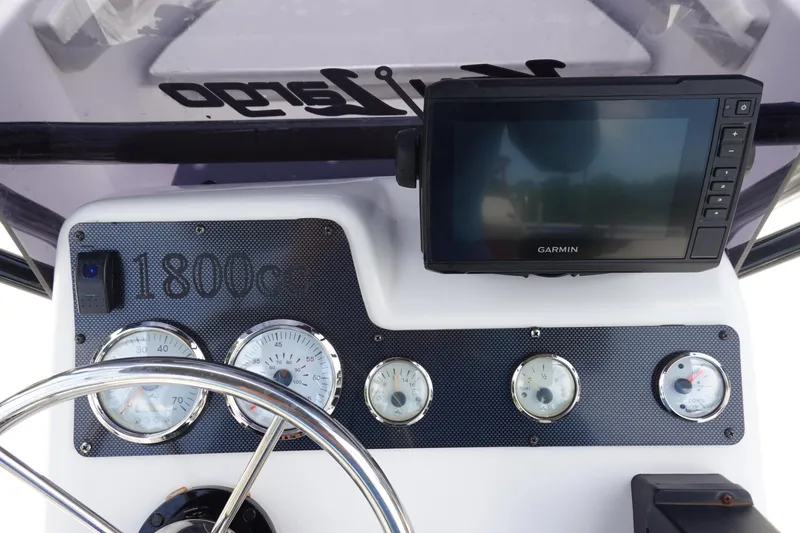 Slide: The Image of Center console of 2022 Key Largo 1800, featuring Garmin display and gauges. - 15