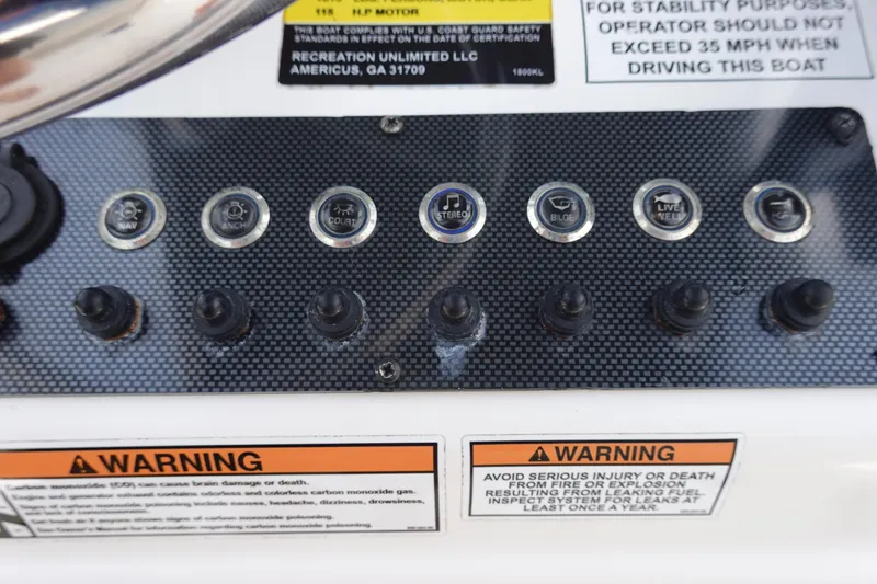 Slide: The Image of Control panel of 2022 Key Largo 1800 Center Console boat with warning labels. - 16