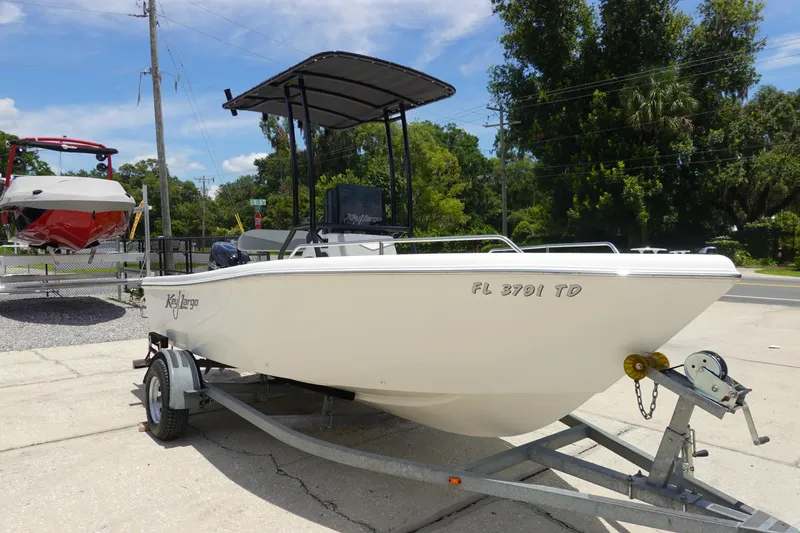 Slide: The Image of 2022 Key Largo 1800 Center Console boat on trailer, parked outdoors. - 3