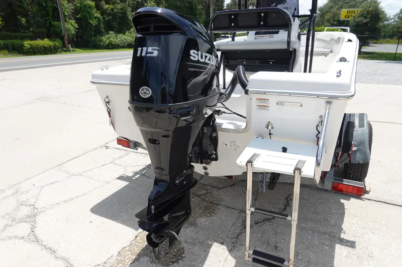 Slide: The Image of 2022 Key Largo 1800 Center Console boat with Suzuki 115 outboard motor and ladder. - 7