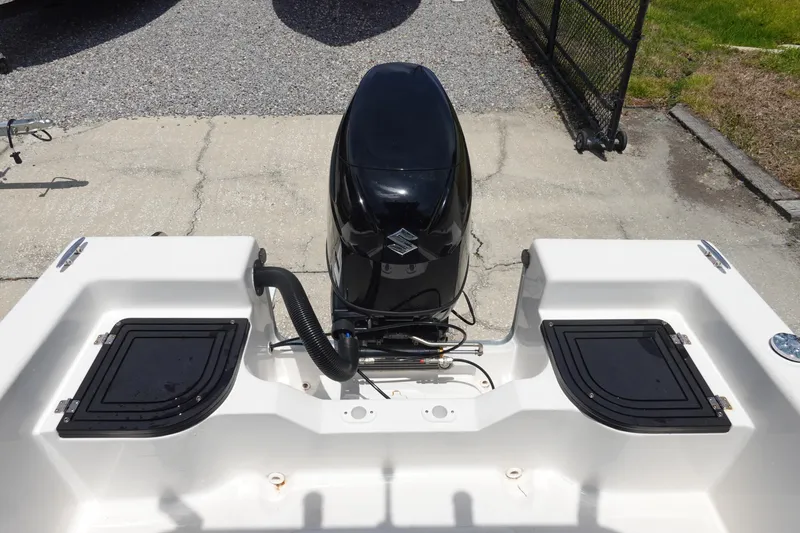 Slide: The Image of 2022 Key Largo 1800 Center Console boat with outboard motor, rear view. - 9