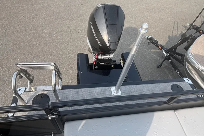 Slide: The Image of 2025 Regency 250 DL3 boat with Mercury outboard motor and trailer attachment. - 10