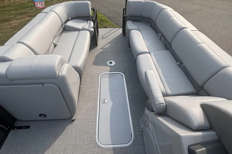 Slide: The Image of Luxurious seating on 2025 Regency 250 DL3 pontoon boat, featuring spacious, comfortable gray upholstery. - 5