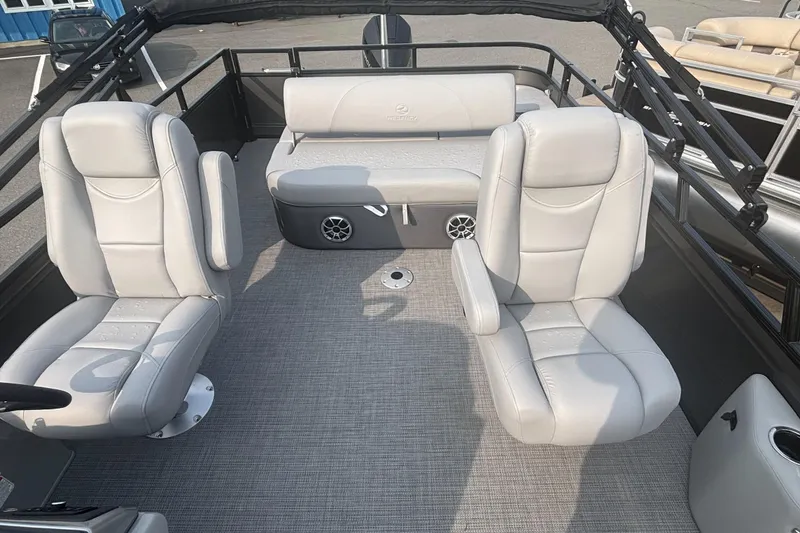 Slide: The Image of 2025 Regency 250 DL3 pontoon boat interior with plush seating and modern design. - 7