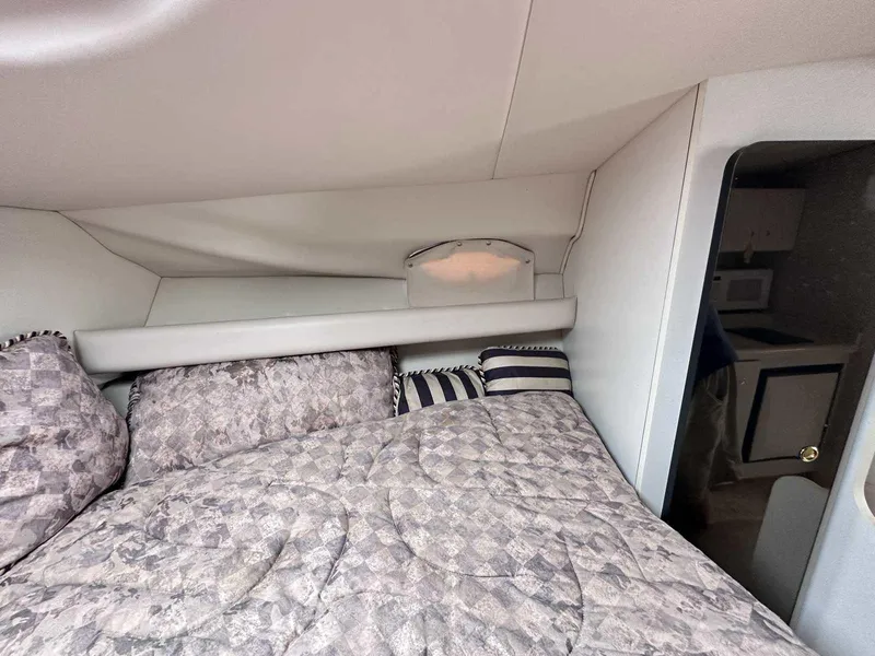 Slide: The Image of Interior cabin of 1998 Cruisers Yachts 3075 Rogue with bed and kitchenette. - 17