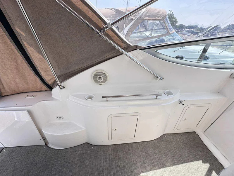 Slide: The Image of 1998 Cruisers Yachts 3075 Rogue interior with storage compartments and speaker. - 5