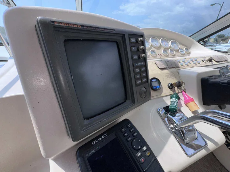 Slide: The Image of 1998 Cruisers Yachts 3075 Rogue dashboard with navigation equipment and controls. - 9
