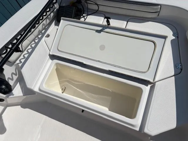 Slide: The Image of Open storage compartment on 2017 Yamaha Boats 190 FSH Deluxe. - 11