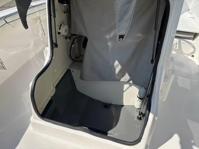 Slide: The Image of Interior view of a 2017 Yamaha Boats 190 FSH Deluxe, showcasing storage space. - 16