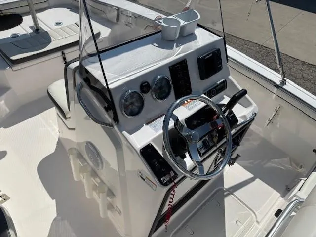 Slide: The Image of 2017 Yamaha Boats 190 FSH Deluxe dashboard with steering wheel and controls. - 20