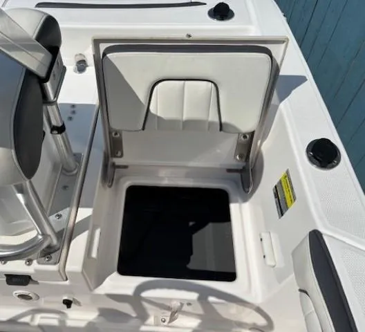 Slide: The Image of 2017 Yamaha Boats 190 FSH Deluxe open storage compartment on deck. - 25