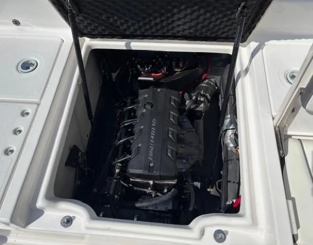 Slide: The Image of Engine compartment of a 2017 Yamaha Boats 190 FSH Deluxe, showcasing the internal mechanics. - 30
