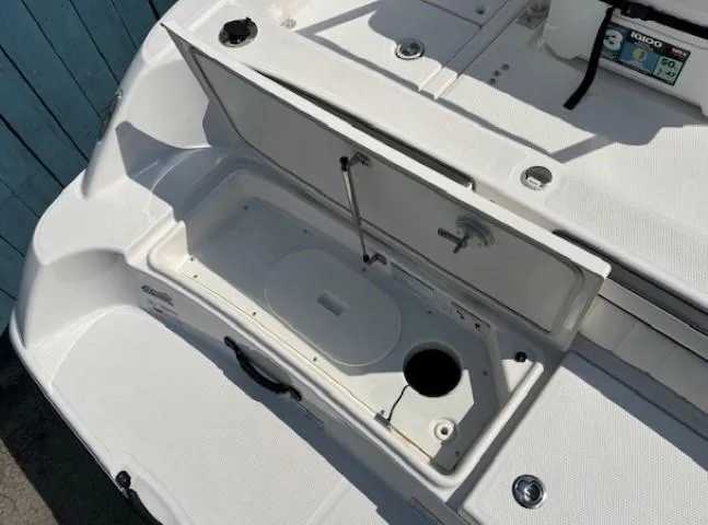 Slide: The Image of 2017 Yamaha Boats 190 FSH Deluxe open storage compartment on deck. - 34