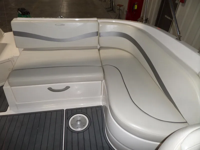 Slide: The Image of 2006 Maxum 2400 SR3 boat interior with gray and white seating. - 12