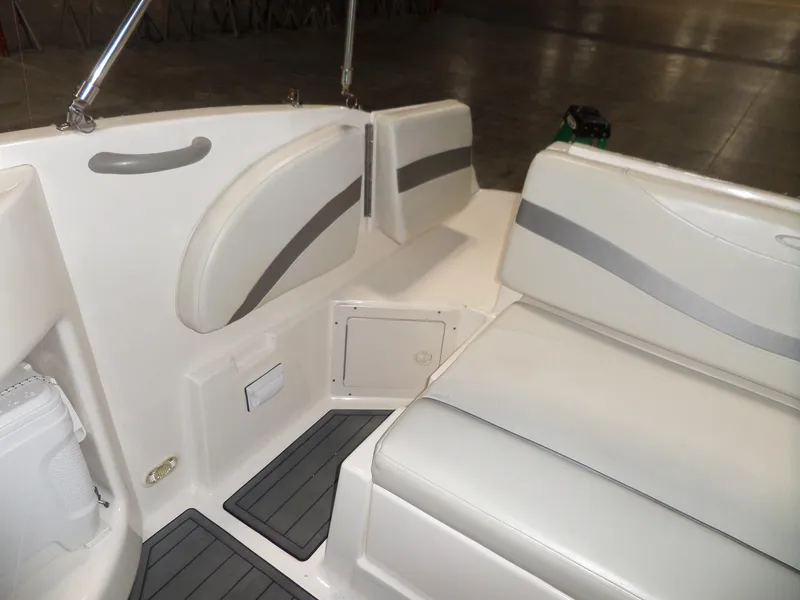 Slide: The Image of 2006 Maxum 2400 SR3 boat interior with white seating and gray accents. - 13