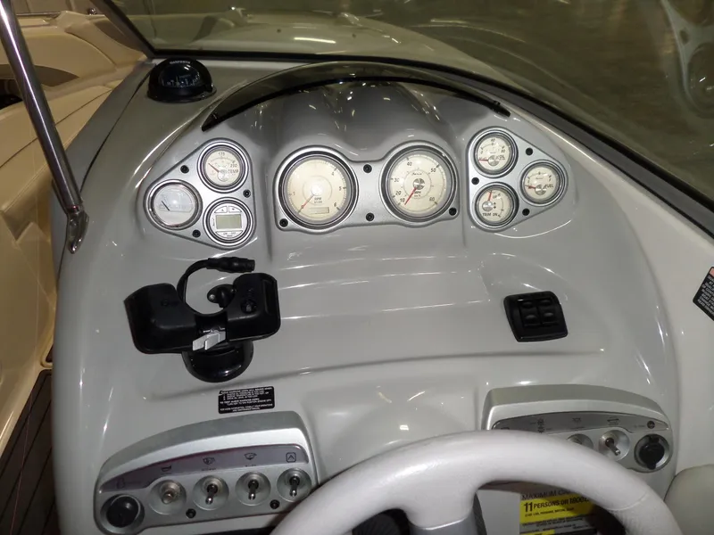 Slide: The Image of 2006 Maxum 2400 SR3 boat dashboard with gauges and controls. - 16