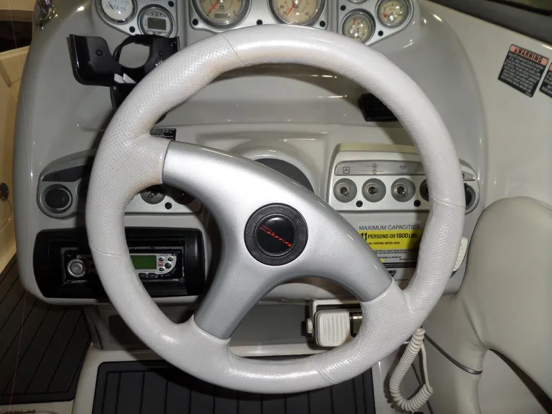 Slide: The Image of Steering wheel and dashboard of 2006 Maxum 2400 SR3 boat. - 19