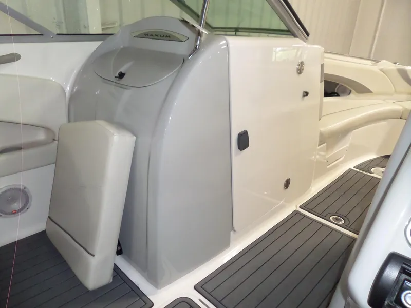 Slide: The Image of 2006 Maxum 2400 SR3 boat interior with seating and storage compartments. - 21