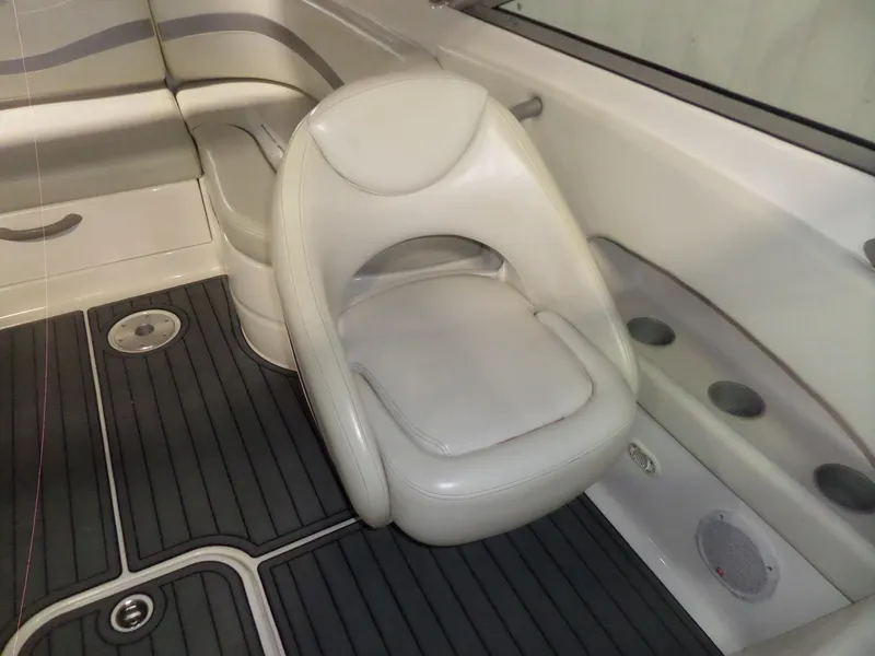 Slide: The Image of 2006 Maxum 2400 SR3 boat interior with white seating and black flooring. - 22