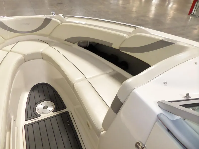 Slide: The Image of 2006 Maxum 2400 SR3 boat interior with cushioned seating and non-slip flooring. - 25