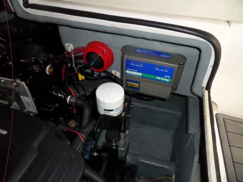 Slide: The Image of Engine compartment of 2006 Maxum 2400 SR3 with battery charger and wiring. - 37