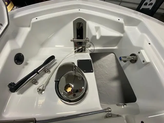 Slide: The Image of 2022 Blackfin 272 CC boat interior, featuring a clean, modern design with stainless steel fixtures. - 11