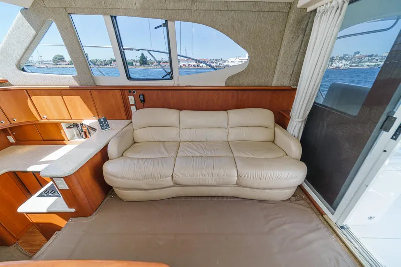 Slide: The Image of Luxurious interior of 2004 Silverton 38 Convertible yacht with cream leather sofa. - 12