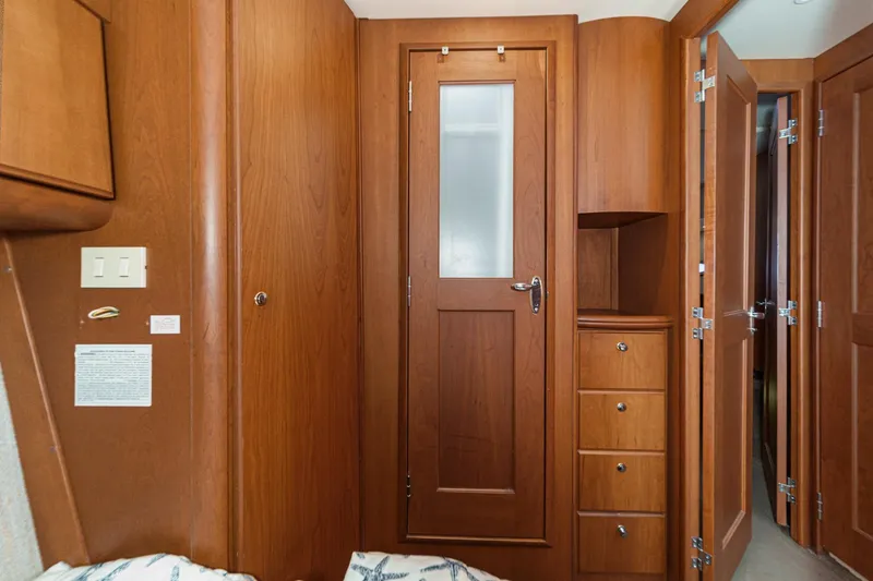 Slide: The Image of Interior of 2004 Silverton 38 Convertible yacht with wooden cabinetry and doors. - 22