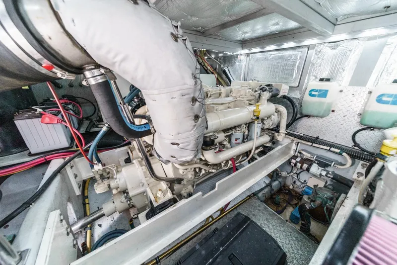 Slide: The Image of Engine room of 2004 Silverton 38 Convertible boat, showcasing detailed mechanical components. - 25