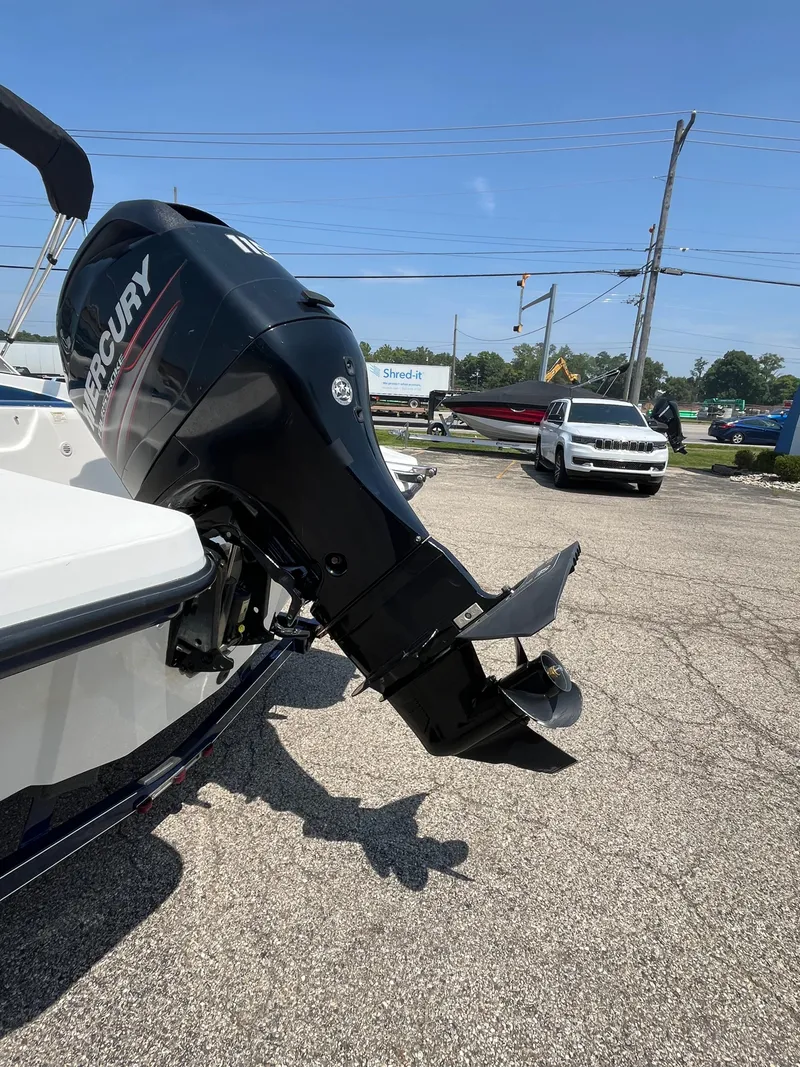 Slide: The Image of 2013 Rinker Captiva 186 BR FS OB with Mercury outboard motor in parking lot. - 12