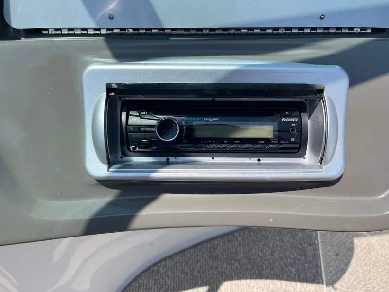 Slide: The Image of Sony stereo system in a 2013 Rinker Captiva 186 BR FS OB boat dashboard. - 15