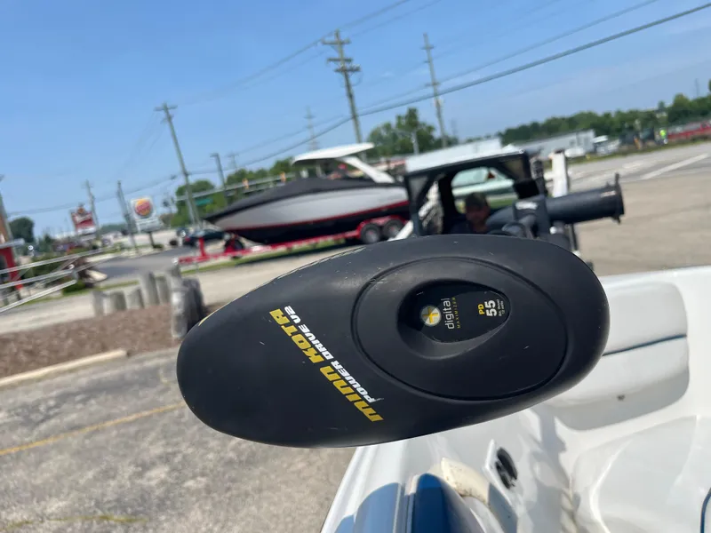 Slide: The Image of 2013 Rinker Captiva 186 BR FS OB with Minn Kota trolling motor in parking lot. - 18