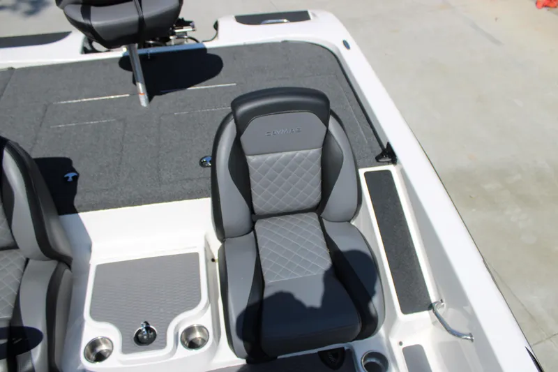 Slide: The Image of 2022 Caymas CX 18 SS boat interior with gray cushioned seats and storage compartments. - 13