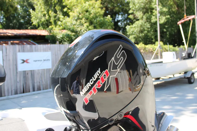 Slide: The Image of 2022 Caymas CX 18 SS with Mercury Pro XS engine in outdoor setting. - 4