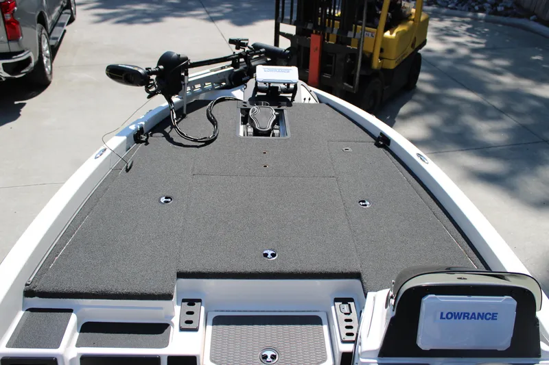 Slide: The Image of 2022 Caymas CX 18 SS boat deck with Lowrance equipment and trolling motor. - 5