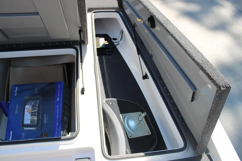 Slide: The Image of 2022 Caymas CX 18 SS storage compartments with electronic equipment and accessories. - 9