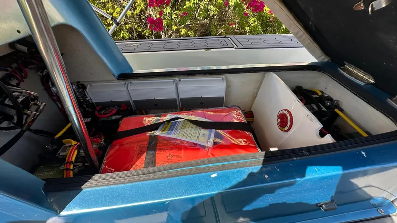 Slide: The Image of Open engine compartment of 2018 Outlaw 300R boat with safety equipment. - 10