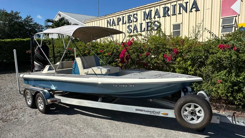 Slide: The Image of 2018 Outlaw 300R boat on trailer at Naples Marina Sales. - 5