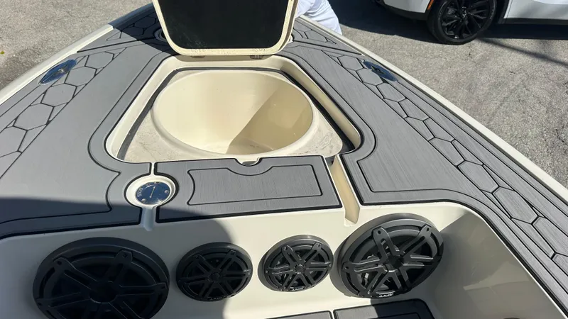 Slide: The Image of 2018 Outlaw 300R boat interior with speakers and storage compartment. - 7