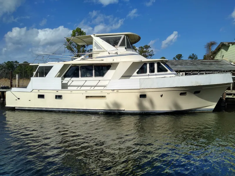 The Image of 1989 DeFever 57 POC Motor Yacht docked on a sunny day with blue skies. - 0