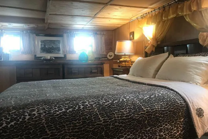 Slide: The Image of Luxurious bedroom interior of 1989 DeFever 57 POC Motor Yacht with elegant decor. - 12