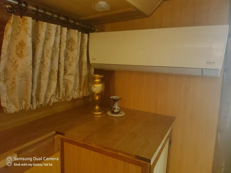 Slide: The Image of Interior of 1989 DeFever 57 POC Motor Yacht with air conditioner and decorative vase. - 13